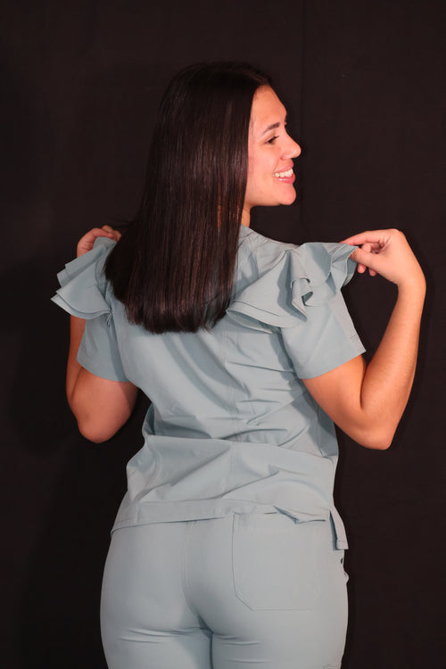Scrub Pistacho Antifluido con Cuello V - vista trasera